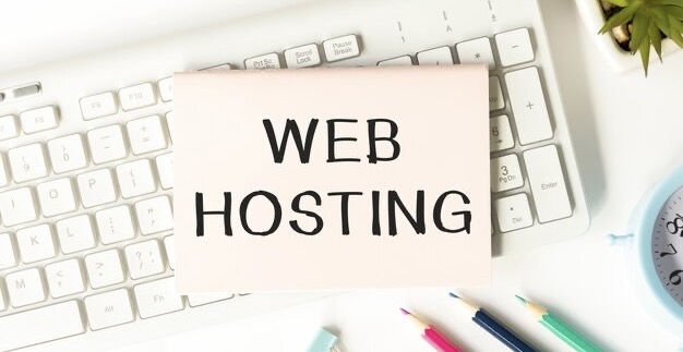 The inscription web hosting on a notepad